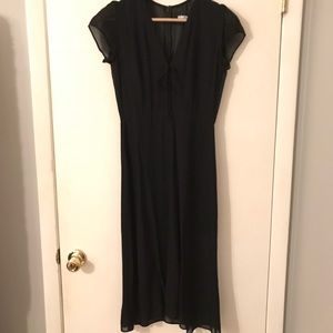 Black midi dress by Reformation.